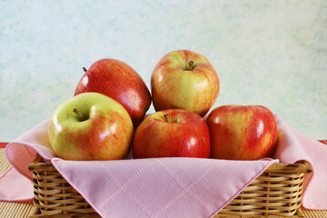 fruit apple isolated in bamboo basket closeup on blur background