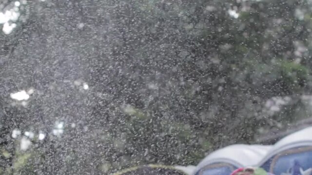 Snow flakes falling in brazilian carnival foam