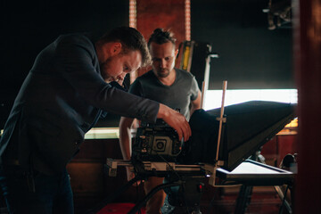 Director of photography with a camera in his hands on the set.