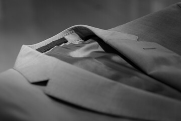 Fashionable men's jacket laying on glass background