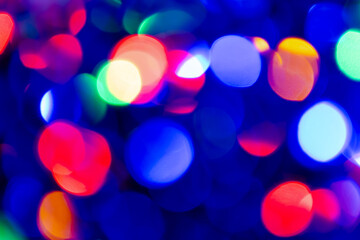 Abstract background with colourful blurred bright circles.