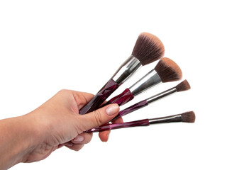 Brushes for make up in hand isolated on the white