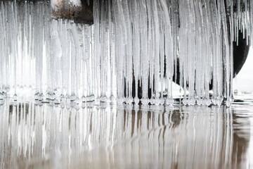 Icicles hanging in the water, on which the balls at the end