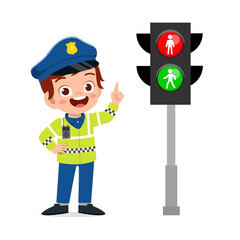 happy cute little kid boy wearing police uniform and stand beside traffic lamp