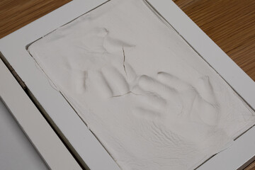 Child's handprints in plaster cast