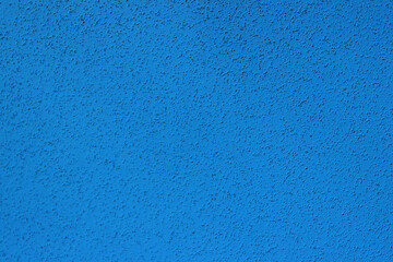 Blurry image of blue wall texture background. Abstract texture backdrop, horizontal view, copy space for text.