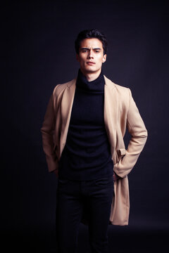 handsome asian fashion looking man posing in studio on black background, lifestyle modern people concept