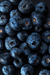 Fresh natural antioxidant blueberries pile, macro detailed close up