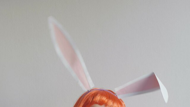 Close-up portrait of a woman wearing bunny ears