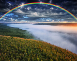 Beautiful landscape with a rainbow in the sky