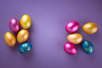 Bright colored eggs on a gray background. Easter theme, holiday. Happy easter card with copy space for text in minimalist easter style. Color of the year. Grey.