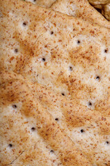 delicious wheat flour cookies and chocolate drops inside the prepared shortbread dough, homemade cookies of irregular round or oval shape, closeup