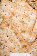 delicious wheat flour cookies and chocolate drops inside the prepared shortbread dough, homemade cookies of irregular round or oval shape, closeup