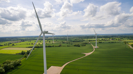 Obraz na płótnie Canvas Windmill On Field Against Sky