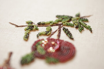 Couture embroidery of pomegranate. Still life with fruits