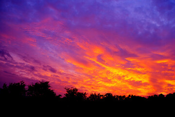 Fototapeta na wymiar Beautiful fiery sunset during twilight hour