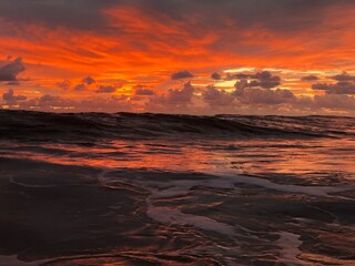 Fototapeta na wymiar Scenic View Of Sea Against Orange Sky