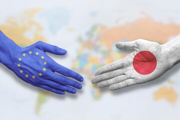 Japan and European Union - Flag handshake symbolizing partnership and cooperation