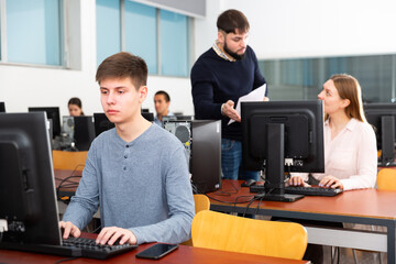 Fototapeta na wymiar Young male student works at computer. High quality photo
