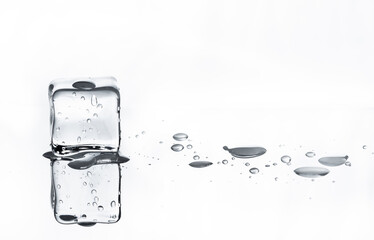 Melting ice cube with white background and reflections