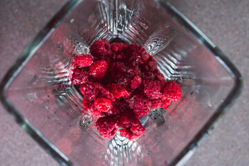 simple food ingredients,  close-up of frozen raspberries with icicles on them