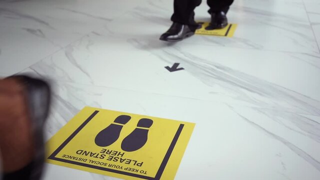 Social Distancing concept, People wearing Face mask standing distance of 1 meter from other people keep distance protect from COVID-19 viruses, Social Distancing Floor Sticker 