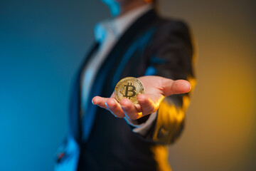Close up shot of Business woman holding golden coin.