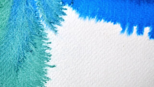 Blue and green color flowing and spreading on the white background , Abstract watercolor hand draw on paper	