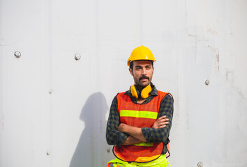 Portrait of Worker man standing with arms crossed at containers cargo