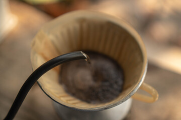 Fototapeta premium Barista Pouring hot water to coffee filter