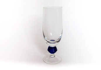 Glass shaped transparent wine glass close up on white background