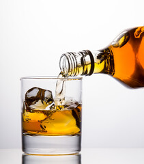 Pouring whisky from a bottle