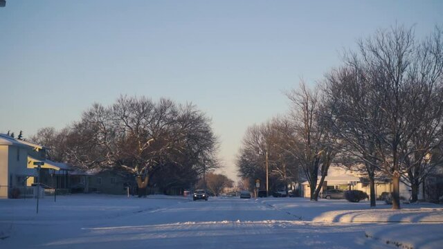 Driving through a Small Snowy Town