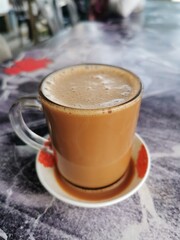 Tea with milk or popularly known as Teh Tarik in Malaysia