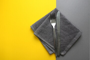Knife and fork lie on a gray napkin