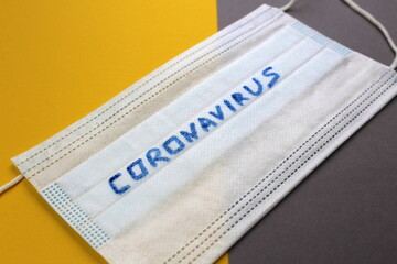 Coronavirus is written on the medical mask.