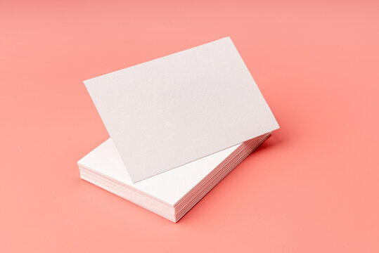 Stack Of Visit Cards On Pink Background For Mock Up Design