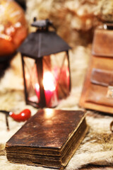 Retro old book and world desk globe on fur, learning and education concepts.