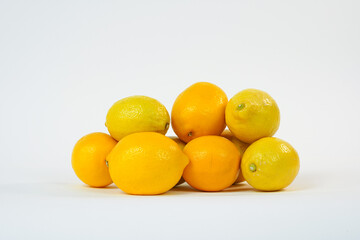 Fresh lemons on white background. Citrus fruit isolated on white. Food Concept. Product for sale. Copy space. High resolution.