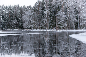 Cold morning in a wintry river landscape. Farnebofjarden national park in north of Sweden.