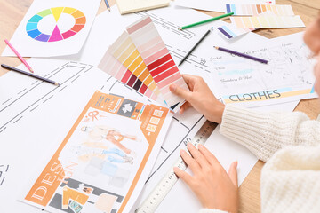 Female fashion designer working in studio, closeup