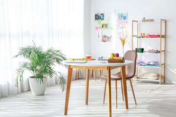 Stylish interior of fashion designer workplace