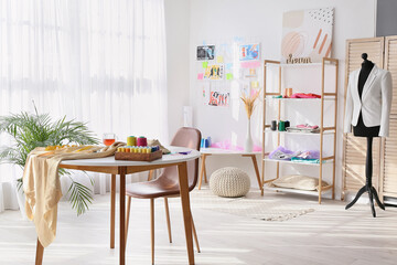 Stylish interior of fashion designer workplace