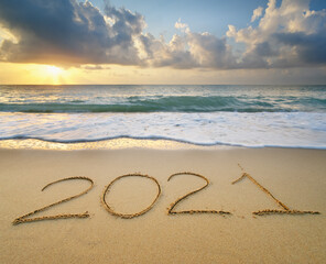 2021 year on the sea shore during sunset