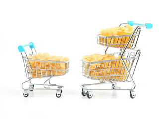 italian pasta in a grocery basket from the market on a white background. flour products and food in cooking