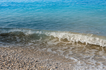 Sea waves on the pebble beach