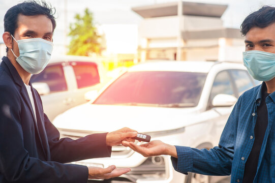 Salesman Wear Mask  Giving Key Car To Customer Concept Business Finance Insurance Coronavirus Covid19