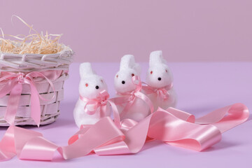 Cute decorated bunny figurines with pink ribbon