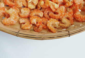Dried salted prawn in bamboo basket.