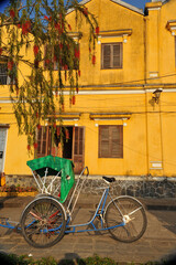 Fototapeta na wymiar A Cyclo (Vietnamese pedicab) at old city of Hoi An, Vietnam